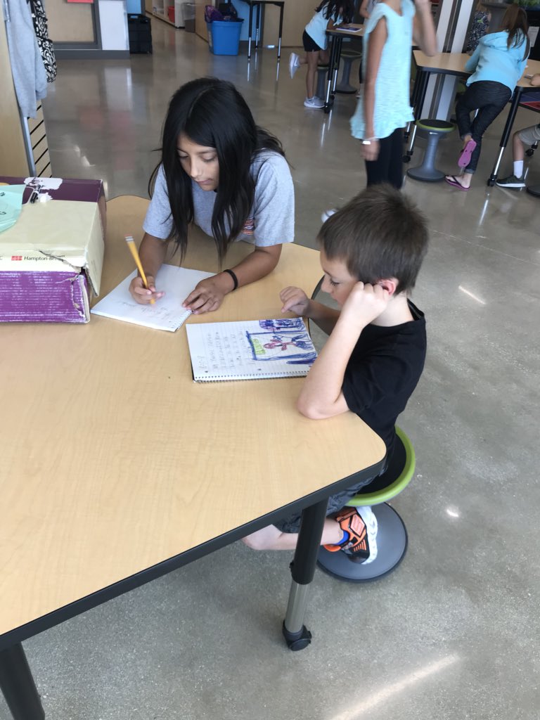 My second graders are choosing flexible seating while sharing their writing about their favorite superhero! We are Super Second Graders #FabraFalcons #falconchat @FabraElem #supersecondgraders