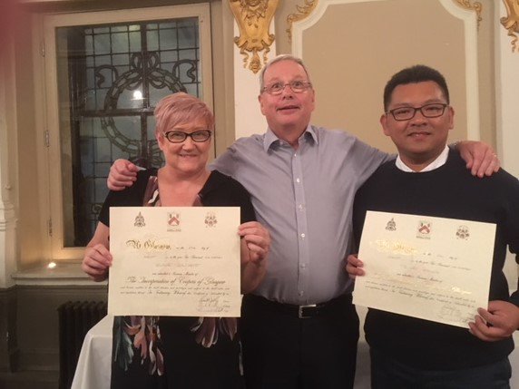 New members Ta-Wei Hsiung, who flew in specially from his home country Taiwan, and Elaine Gilchrist receiving their certificates from Collector Alasdair Ronald.