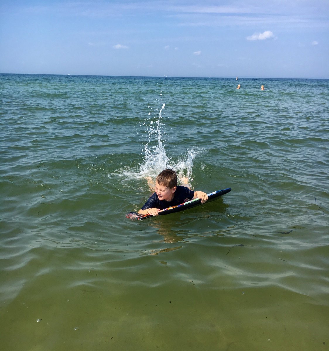 Riding the waves. 🌊 #capecod #oceanadventures #boogieboarding #kidapproved