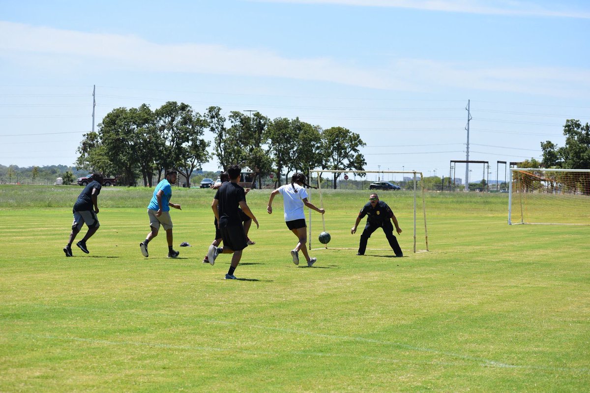 UNTEngineering's tweet photo. .@UNTPolice Sgt. Hester subbed in for a game of soccer with the students at @DPLife_UNT! Go, Hester! Go! ⚽️ 🥅 https://t.co/fNie5TJ5AN