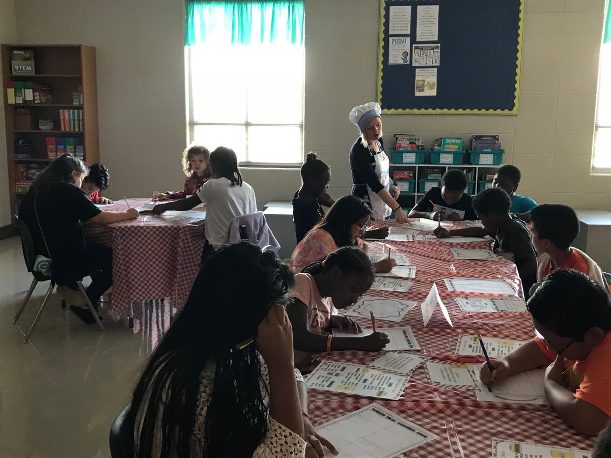 Morris P-8 Principal Patty Boyd encourages teachers and students to collaborate while problem solving during a “Real Life” Decimal Diner Math activity.  SOAR EAGLES