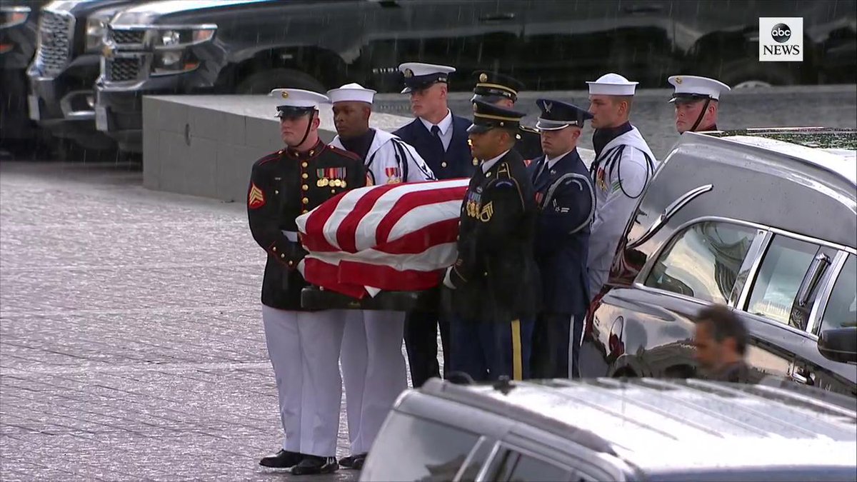 John McCain's flag-draped casket diligently carried up the steps, in ...