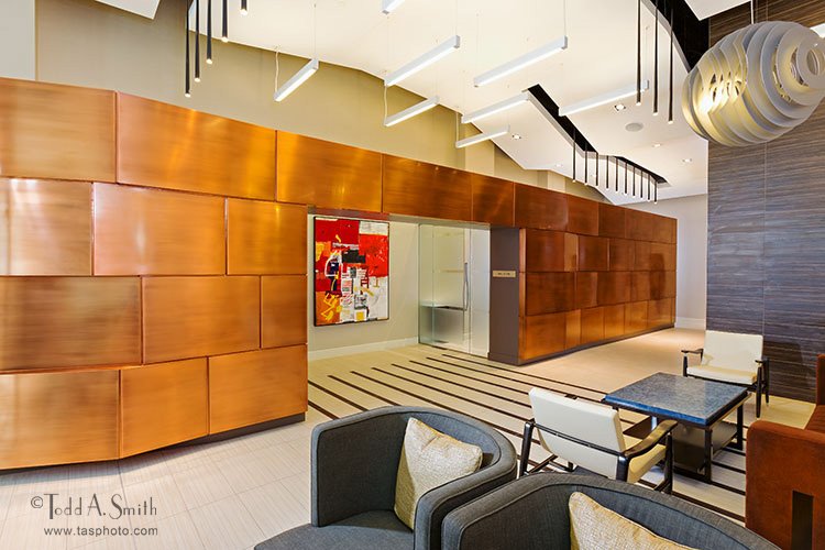 Stunning copper wall that is a real "Wow!" factor in one of the lobbies of Flats 130 at Constitution Square in Washington, DC.  Architect: SK&amp;I Architecture + Design, <a href="/skiarchitecture/">SK+I Architecture</a>.  Managed by The Bozzuto Group, <a href="/thebozzutogroup/">The Bozzuto Group</a> .  Photo: ©Todd A. Smith