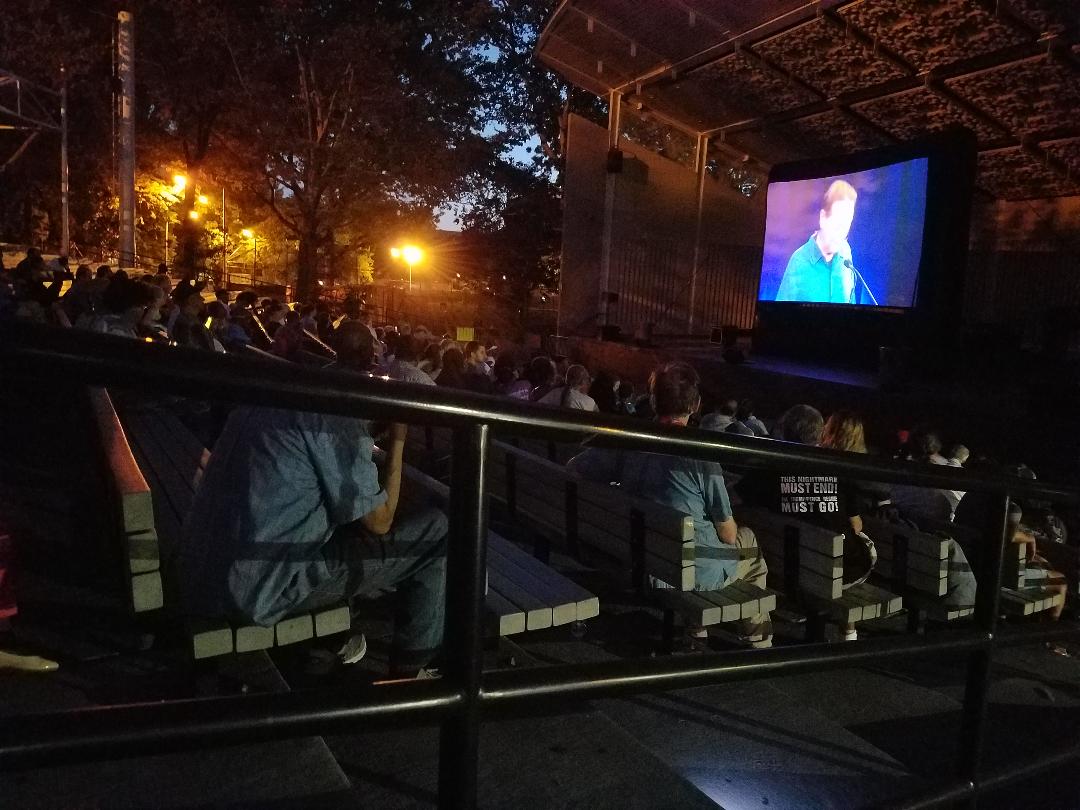 RevBooksNYC's tweet image. Crowd on Thursday night at Marcus Garvey Park amphitheater watching the film of #BobAvakian&apos;s #TrumpPenceMustGo speech.

Be part of the movement growing in understanding and determination to oust this regime

&quot;There is a direct line from the Confederacy to the fascists today...&quot;