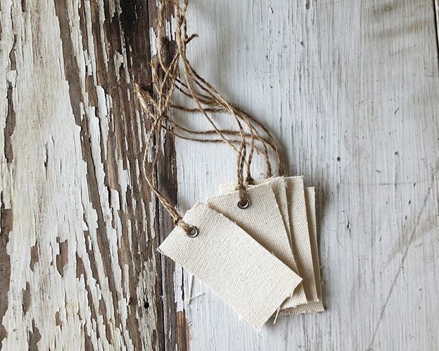 olivemanna's tweet photo. Cutting another batch of canvas hang tags... cutting them from primed artist canvas gives them a stronger feel and a smooth surface or writing or stamping. Each one is punched, grommet added, and jute twine tied, by hand one at a time, right here. Ask about bulk/wholesale or… https://t.co/JxPIUpTOzF