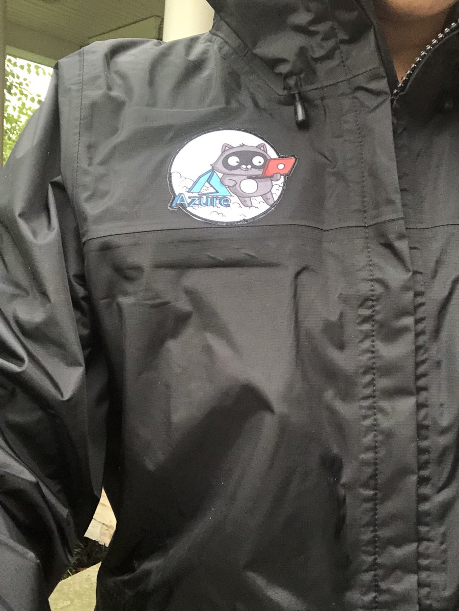 ExchangeGoddess's tweet photo. With all the rain today I finally broke out the @azureadvocates jacket I received at #CDASummit #AzOps #KeepingDry https://t.co/5t0Sh7CpdT