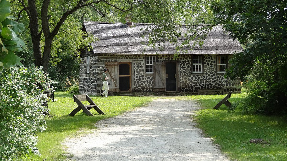 The foundation is local field stone, rafters of hewn or sawn lumber, shingle roof and brick chimney. The chimney can easily be made from bricks dug and burnt on the spot. Interior whitewashed, the left end reserved for the family chickens.