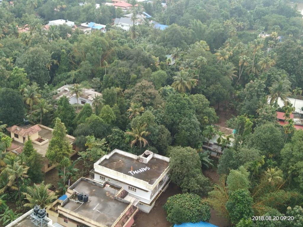 BDUTT's tweet photo. Such a moving graceful moment in the middle of tragedy of #keralafloods . A special Thank You written on the roof of a house from where the heroic Cdr Vijay Varma rescued two young women after making headlines for enabling fully pregnant Sajitha's evacuations and delivery. https://t.co/puzv6iDZm3