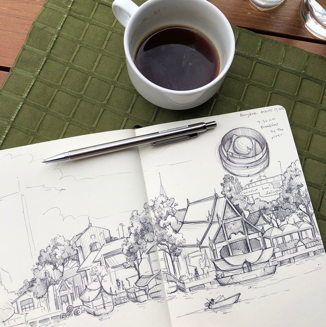 sketching the river over coffee