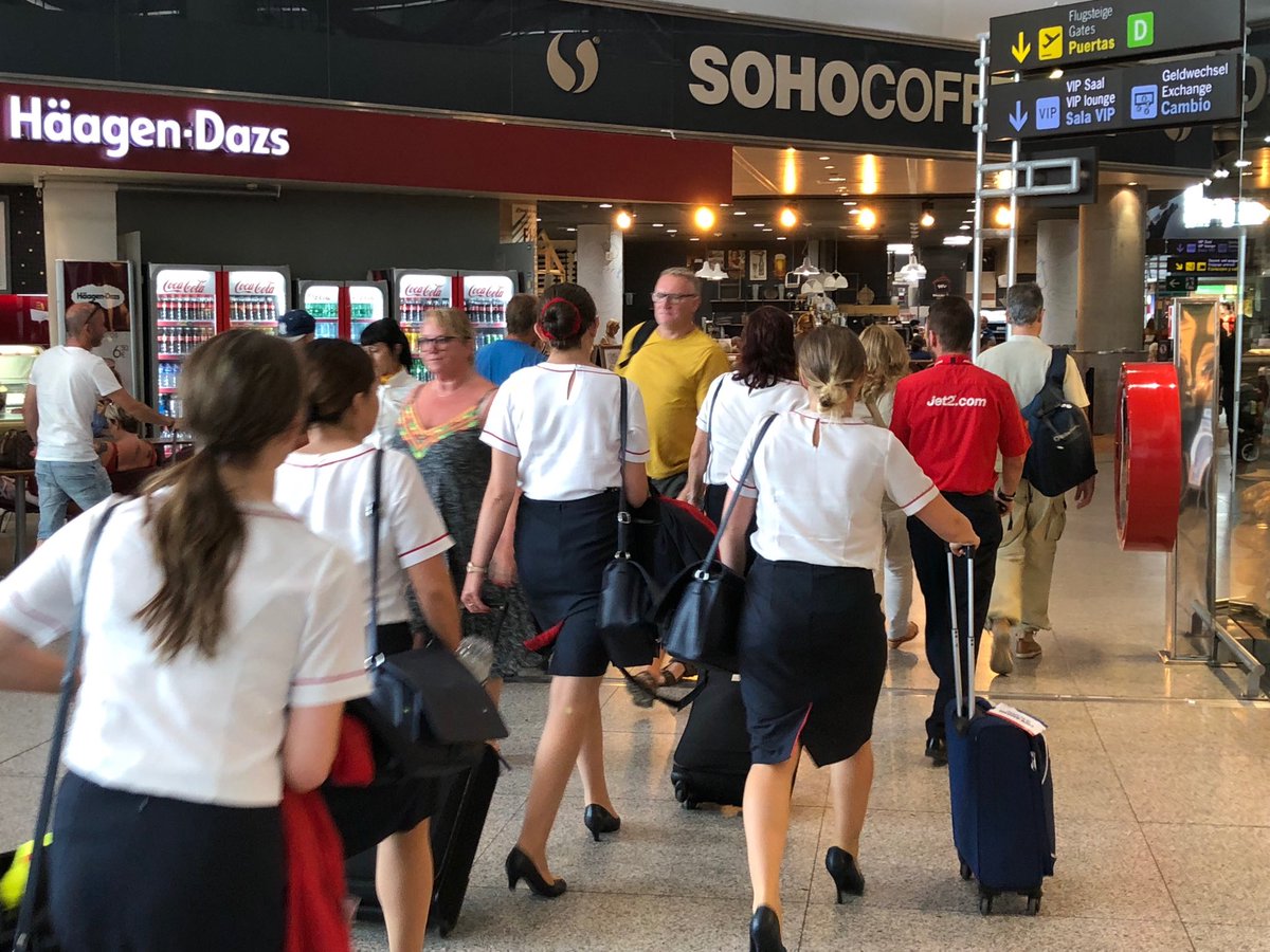 AndrewMilner4's tweet photo. What’s happening Jet2?  Here’s the cabin crew being led off away from the departure gate, when asked they have no idea why.  Flight delays have started again #Jet2 #boeing #knackeredaircraft #jet2malaga https://t.co/WYhMkZvBwA
