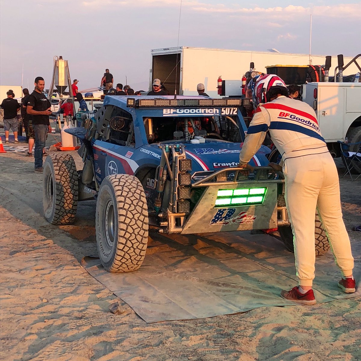GrabowskiRacing's tweet photo. When you put the big guy in the little suit. Sorry Adam haha. Pit Stop at Vegas to Reno. | Sponsors: @CrawfordMotors @subaru_usa @BFGoodrichTires @kingshocks @TerribleHerbst @HerbstSmithFab @RallySportTweet @JEPistons1 @CBRperformance #proamracing #mckenzies #gglighting #revlock https://t.co/H8HMEZU1k4