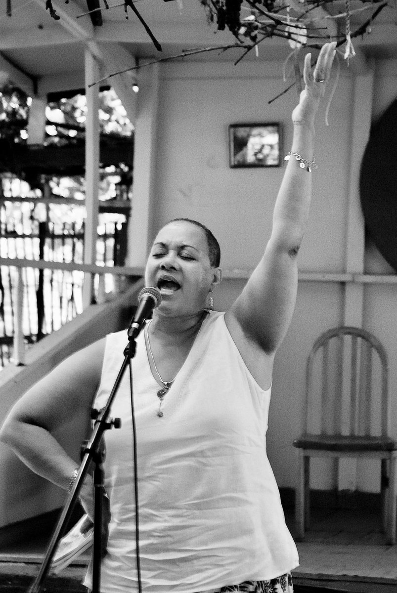 BxCultureColl's tweet photo. Poet Maria Aponte-González brings the fire during the 5th session of Stage Garden Rumba at Rincón Criollo (La Casita de Chema). Event was organized by Pregones and Nos Quedamos. 8/18/18. #edwinpagan #thepaganimage #seisdelsur #stagegardenrumba #bronxDNA @pregonesprtt @nosquedamos https://t.co/FP1uBtw2rc