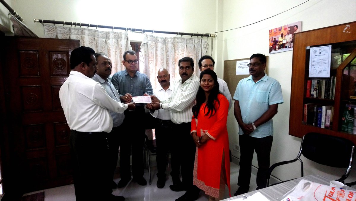 Mr. P P Varghese, Regional Chairman of YMCA Central India Region receiving 2 Lakhs from YMCA Bhopal, Madhya Pradesh, India for flood relief donation of Kerala by National Council of YMCAs of India. Jose, Secretary, YMCA Bhopal