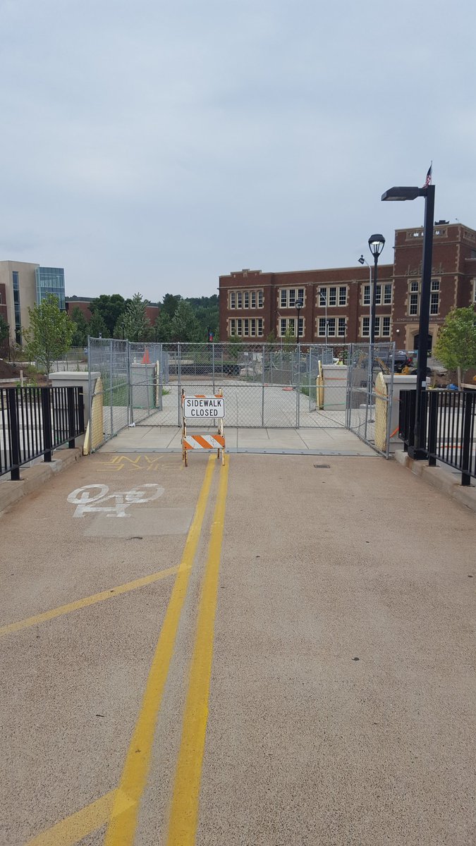 UWEC_POLICE's tweet photo. While we appreciate the convenience of using the #UWEC Footbridge to get across the river, the fact remains that it is still closed to pedestrians and bikes. We would hate to have you get stuck in wet cement. 602 #openingsoon #clearlymarked https://t.co/6KRWpBWG5v