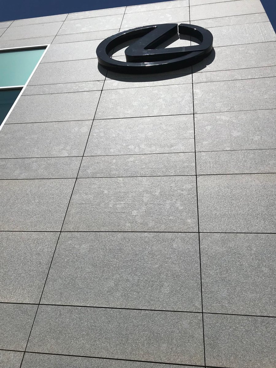 StonePanelsIntl's tweet photo. StoneLite® Impala Black granite panels were manufactured with a flamed and blushed finish to compliment other platinum hued materials. The flaming process not only changed the color to a more platinum hue but provided a textural element. https://t.co/SHPylagepG