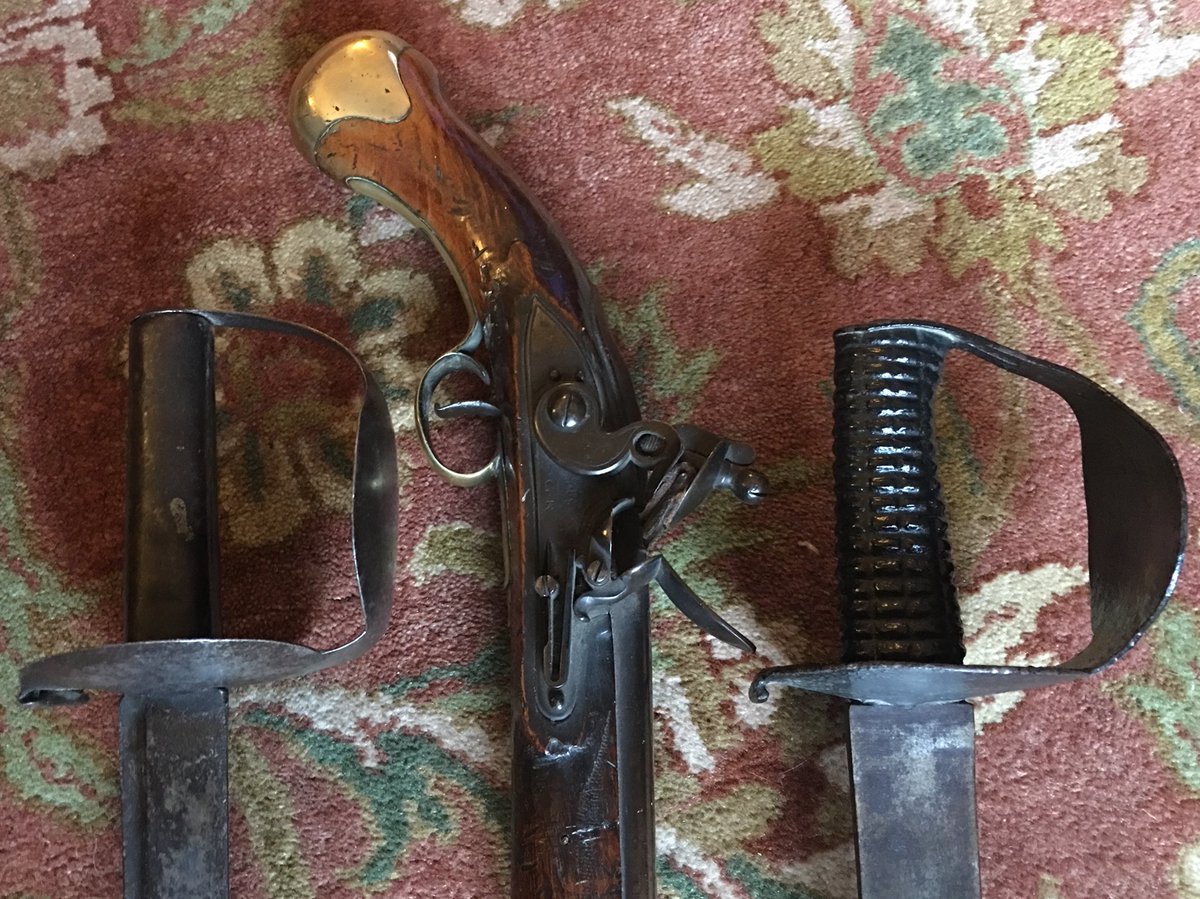 ThePaulLaidlaw's tweet image. Small arms of the Royal Navy at Trafalgar. 18th Century cutlass, the iconic Pattern 1804 “double disc hilt” cutlass, and a Sea Service flintlock pistol. As the Scottish collector of antique arms and armour Robert Lyons Scott put it, “the real fighting stuff”