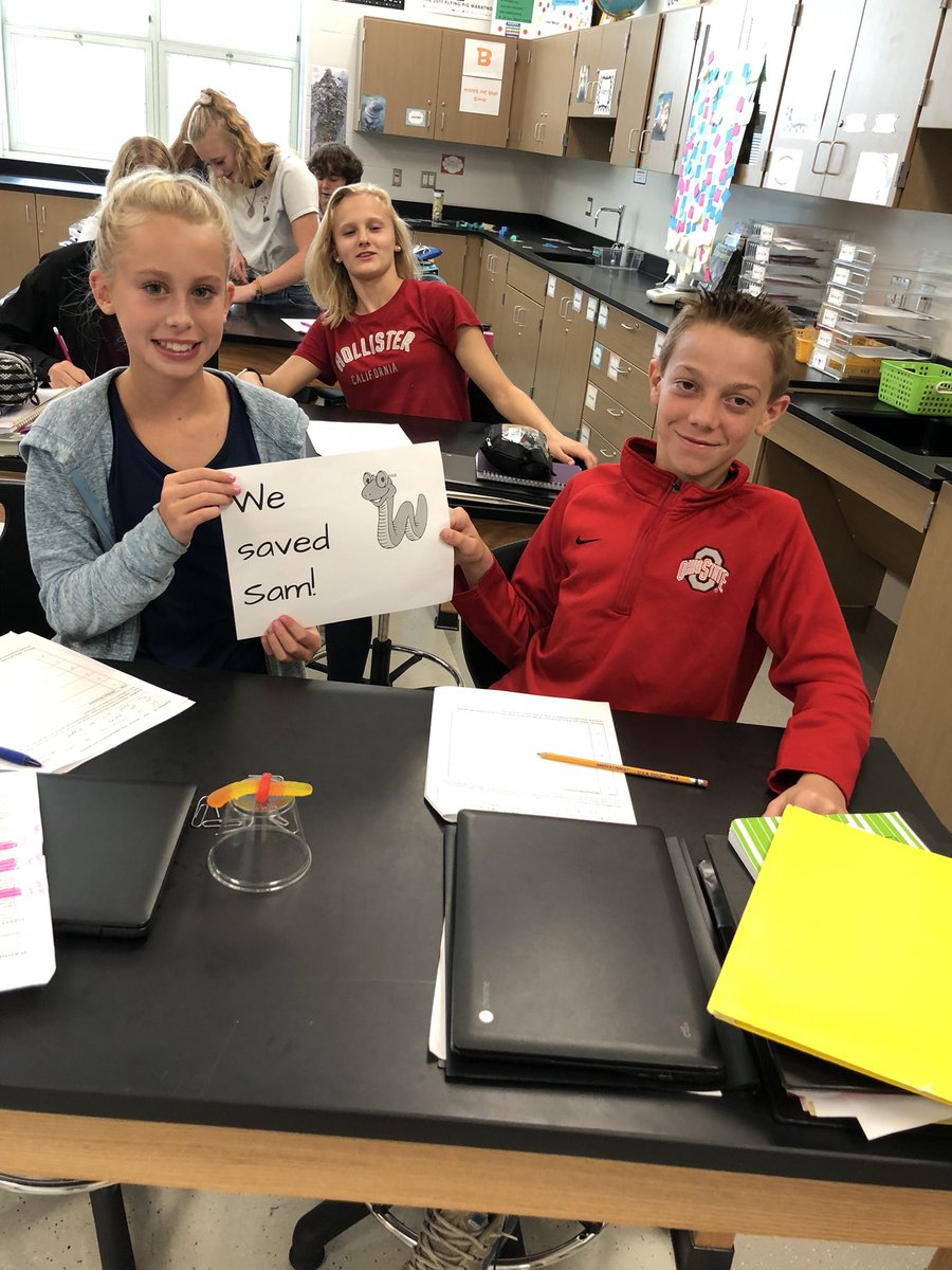 8th grade science students practice teamwork and the scientific method by “Saving Sam.”