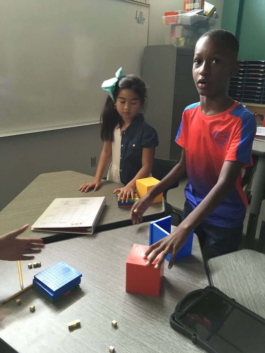 Using our manipulatives to discover place value in our own way! #TeamBCE #wearegcisd #makingmathfun #peercollaboration