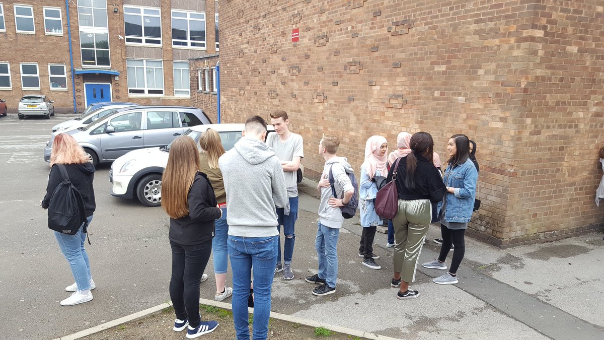Pupils <a href="/derbyhighbury/">The Derby High, Bury</a> wait to collect their results this morning