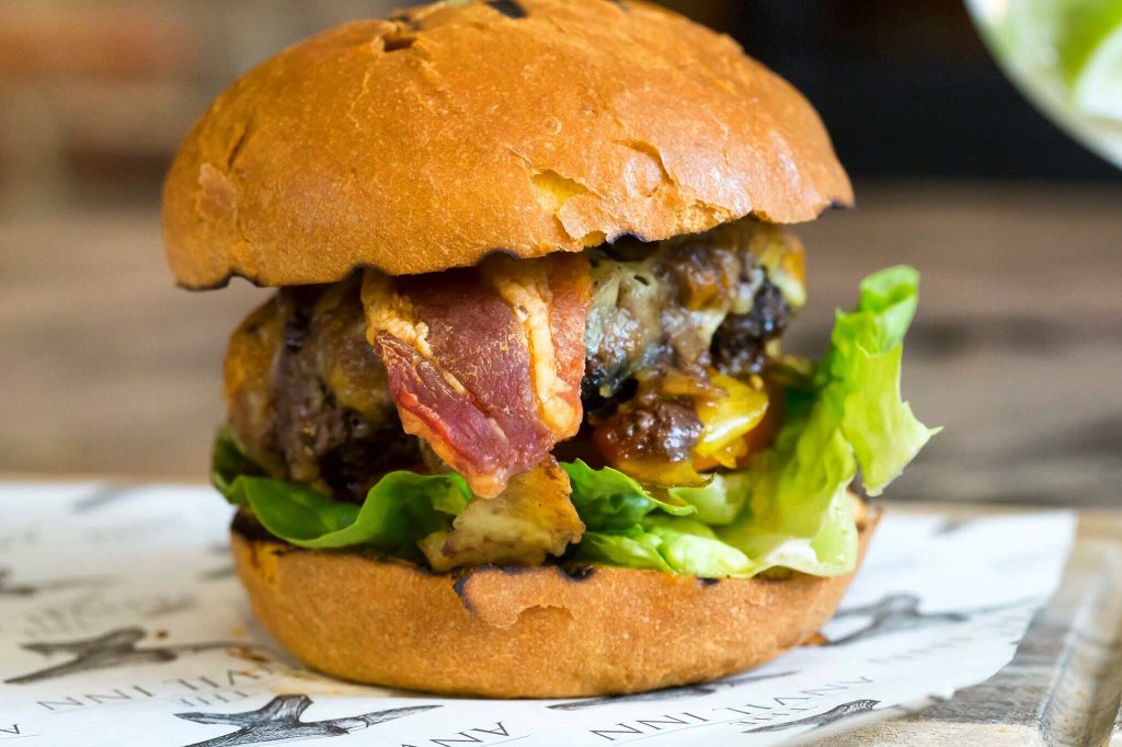 It's #NationalBurgerDay! Let us know your perfect burger recommendations ...although we might regret asking, because this mouth watering burger from <a href="/TheAnvilDorset/">The Anvil Inn</a> has us dreaming about lunchtime already! 
#bphallwoodhouse #hallandwoodhouse #anvilpimperne