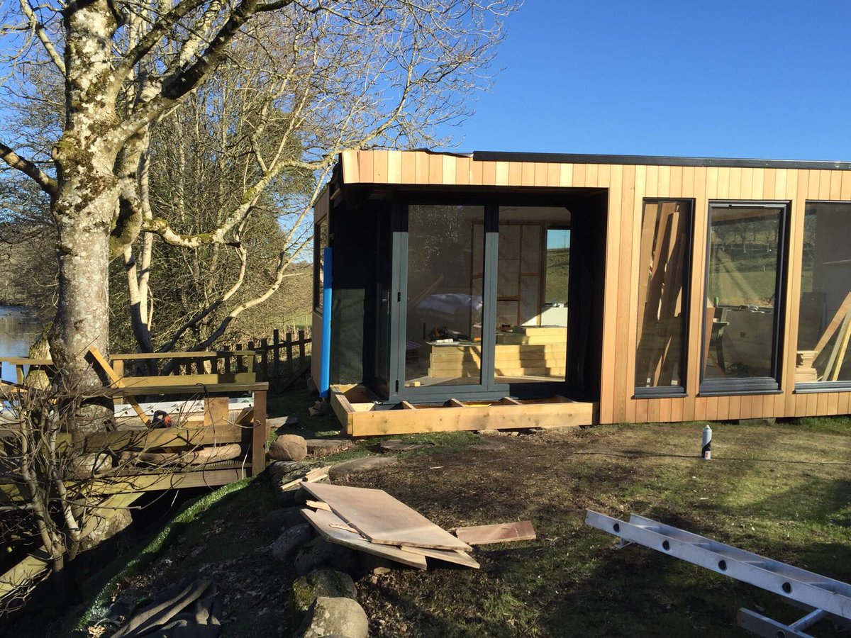 Garden room being built as a separate office space with stunning views all around. We supplied and installed a corner set bifold door using our EK160 system with moving corner post which means a perfect view of the river &amp; bridge when the doors are open with no post in the corner