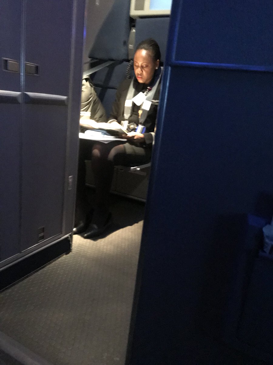 GregHoefer's tweet photo. @united what do the domestic flight attendants do? Read books...allllll flight. Can I get a cup of coffee? Nope. But she will be ready for book club! #unitedfirstclass https://t.co/LPQJ4huFuE