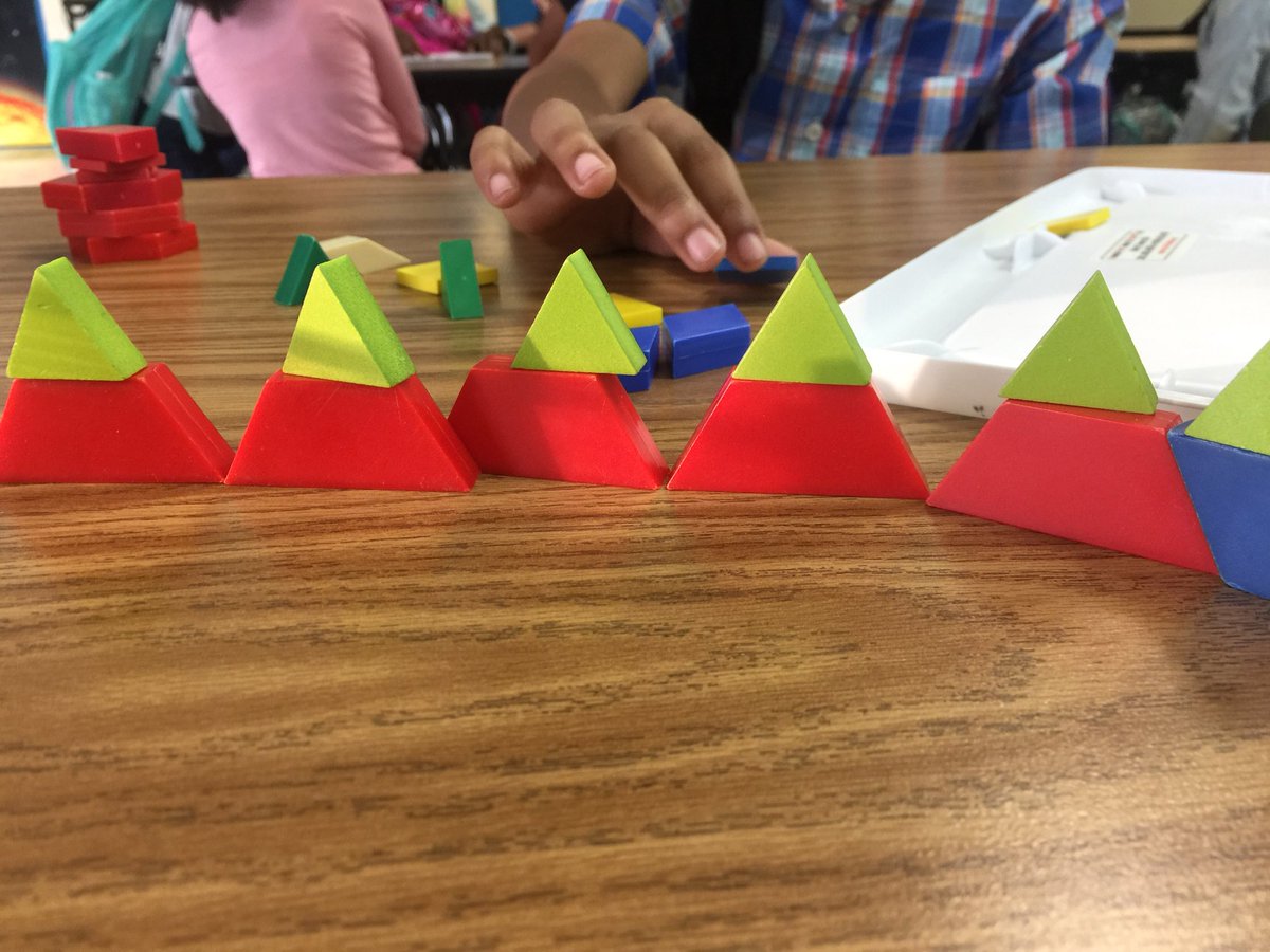 pamjdial's tweet photo. I love to watch how our students think creatively when they are given the opportunity to explore! This student made vertical triangles by stacking trapezoids and smaller triangles! #MustangsMustSTEM #LRSDPowerofUs  @lrsd @MichaelPoore1 @sadiemi73712680 https://t.co/1i29ddTSNW