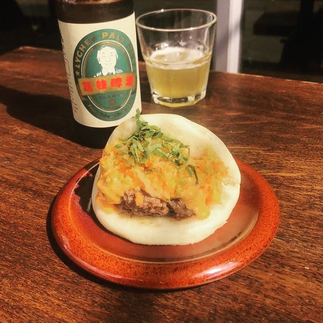 It's #NationalBurgerDay 🍔 and we're getting in on the action with this beefy spesh! Five-spiced patty with Sriracha mayo, pickled carrot and cabbage. 🐄