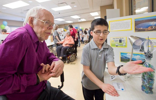SchlegelVillage's tweet photo. A few months ago, the @SchlegelUW_RIA and @Village_UG Innovation Team co-hosted a #CuriosityFair. Quinn shared all he knew about solar power while his great-grandfather, a former professor of chemical engineering @UWaterloo, proudly watched. https://t.co/aYlqIKzSOC https://t.co/b2uwOBzOJD