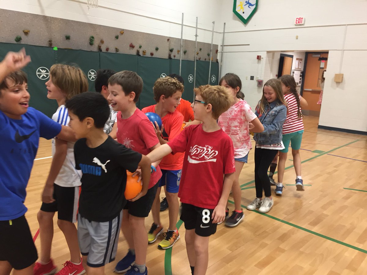 Team Building—a congo line to transport a ball from one side of the gym to the other side.#willowbrook50th