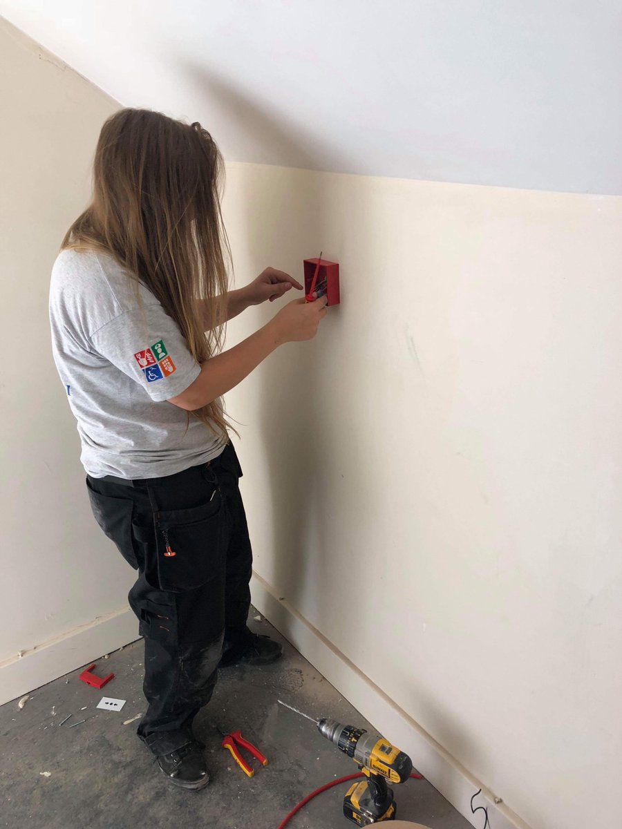 SouthernCountyC's tweet photo. Our apprentice Beth working alongside one of our engineers carrying out the installation of some Break Glass Call Points into one of our customers homes #firealarm #engineer #nursinghome #southerncountycare #apprenticeship https://t.co/CcxO26A7Qu