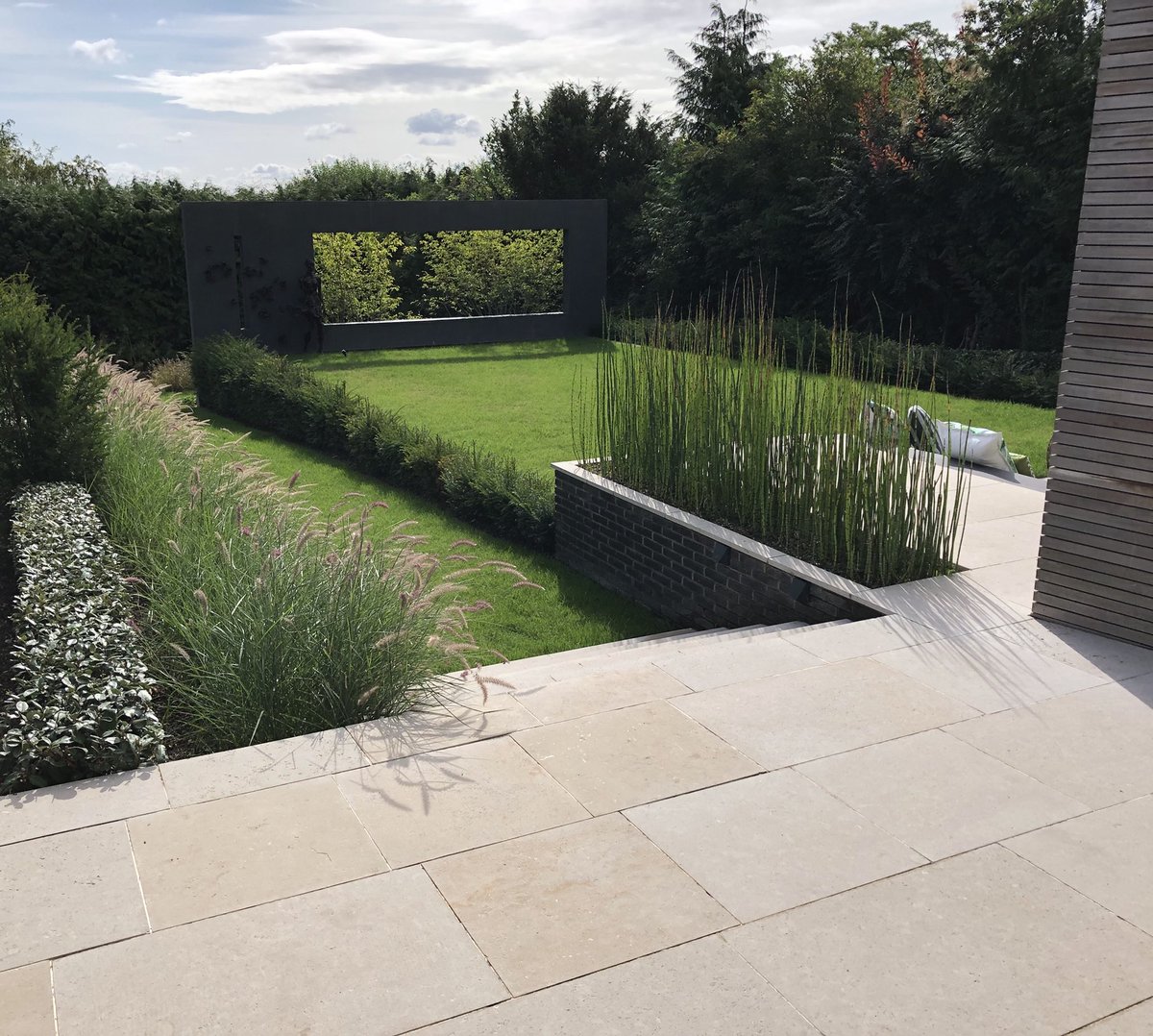 lands4living's tweet photo. #landscapes4living been back to view & photograph today. Project growing in well. Some build this one brings it all back .Design by@stuarttowner great layout and connection to building. #apl #londonstone Egyptian limestone #inlite https://t.co/KyFlIaxvyE