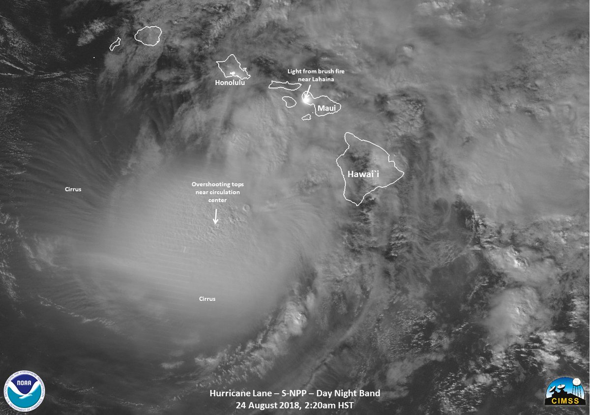 NOAA-20 nighttime satellite imagery of Hurricane Lane lumbering near Hawaii. The light from a large brush fire near the Lahaina resort area of Maui can also be seen.