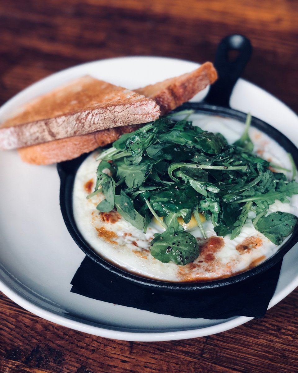 This is for my people striving for good health, welcome Shakshuka- poached egg in a tomato chili stew, baby arugula, cilantro, toasted ciabatta.. Served every Saturday and Sunday Brunch! #freshretro #bottomlessbrunch