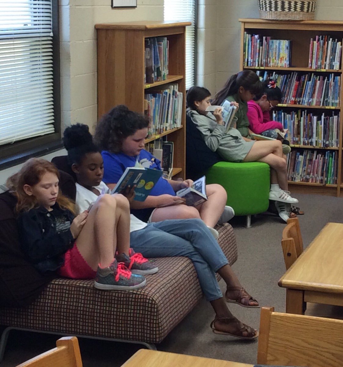 MrsDeLaoLibrary's tweet photo. LOVE that my kiddos were soooo excited to pick a comfy spot and read! It was 📖 bliss! #tlchat #turner202strong https://t.co/1TpVpeRn1e