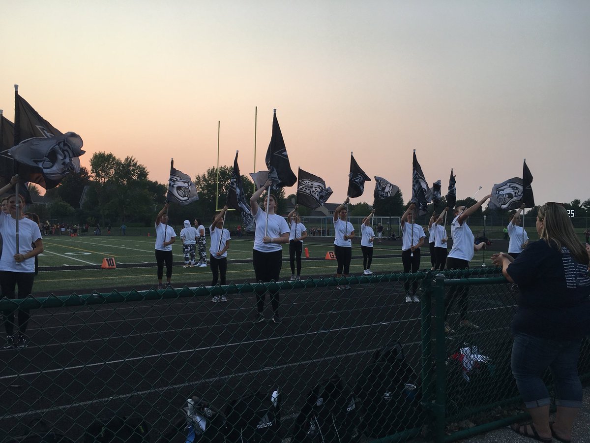 ACHSGuard's tweet photo. First football game with the new flags!!! Thanks, @AnkenyCheer for sharing the track with us!! 🖤🐾 #jaguarpride #spiritflags https://t.co/nCGj5ggyQK