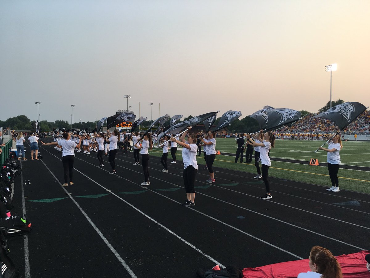 ACHSGuard's tweet photo. First football game with the new flags!!! Thanks, @AnkenyCheer for sharing the track with us!! 🖤🐾 #jaguarpride #spiritflags https://t.co/nCGj5ggyQK