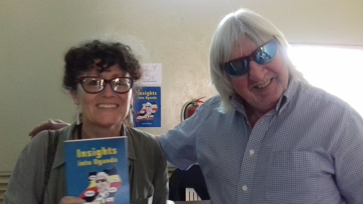 At the market now. <a href="/o/">O</a>'connor showing off his book to a market visitor.
