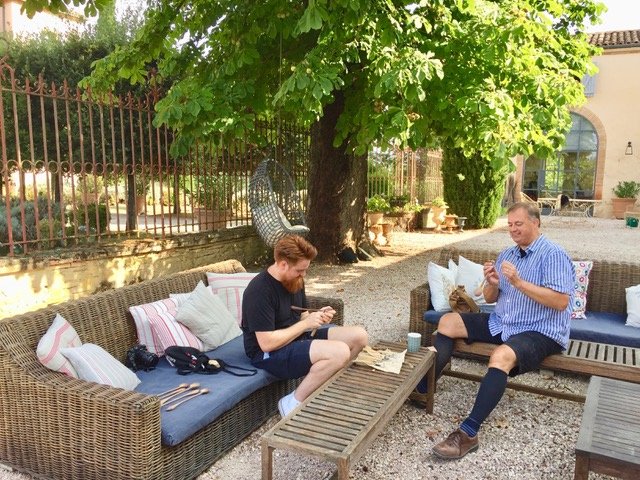 While the women stitch the men whittle!  Our “non-participating” partners this week entertain themselves by carving spoons.