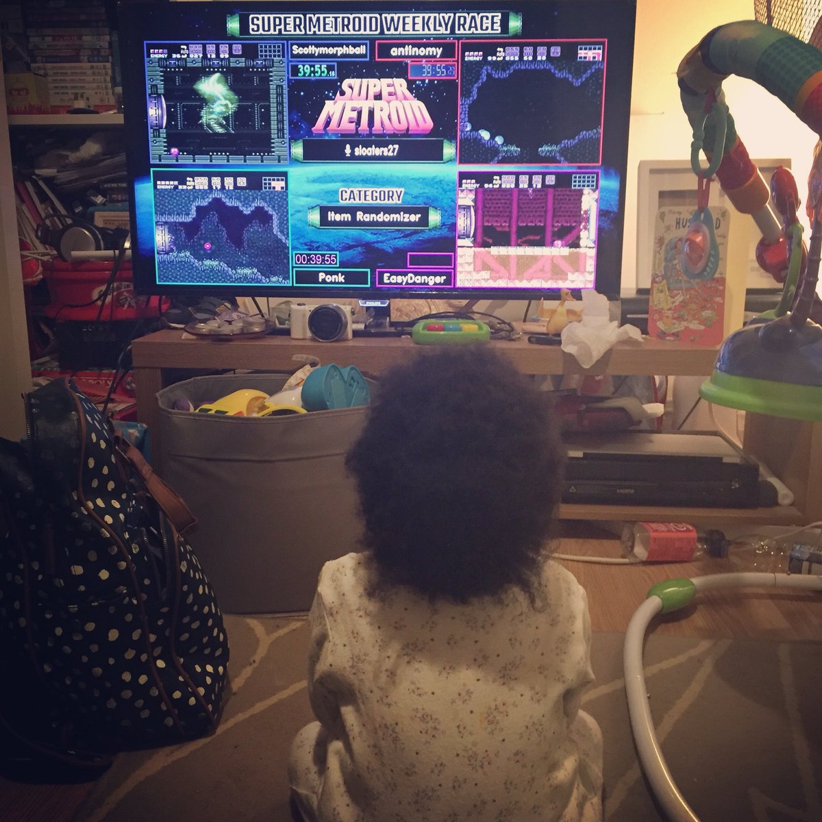 GiggaBubs's tweet image. My little nerd in the making☺️ Zari does like watching the weekly #supermetroid races and tournaments with me. She even points at the screen and tells me what’s happening. That’s my girl 👍🏾#babynerd #futureesportstar