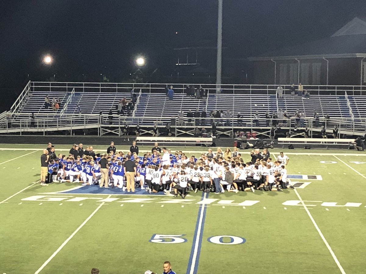 DeenaColl's tweet photo. At the end of the night, this is what matters, two teams coming together supporting an injured player. 💙🏈💙 https://t.co/hEmKTeGf7C