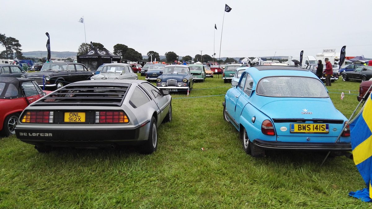 deloreanhs's tweet photo. The D and our friend The Troll's 96 V4 ๐ Ladybank car show is very wet ๐ #stillstylish #delorean #bttf #backtothefuture #sunoverrated https://t.co/6phgTTd45Y