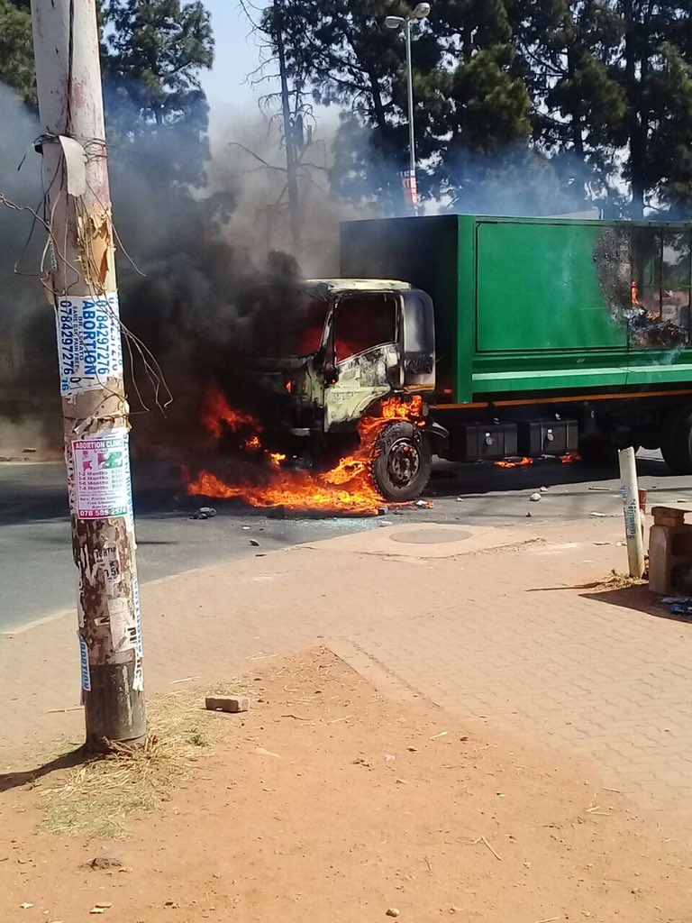 CleanerJoburg's tweet photo. Protesting residents torch pikitup refuse collection truck causing delays in refuse collection se vices https://t.co/ni6OIFV95S