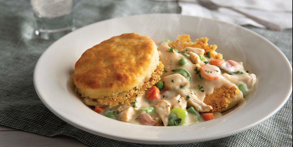 Delish's tweet photo. Cracker Barrel Is Now Selling Biscuit Pot Pie And Biscuit Fresh Toast https://t.co/A8syQlqzsG https://t.co/AvUJThF2Mc