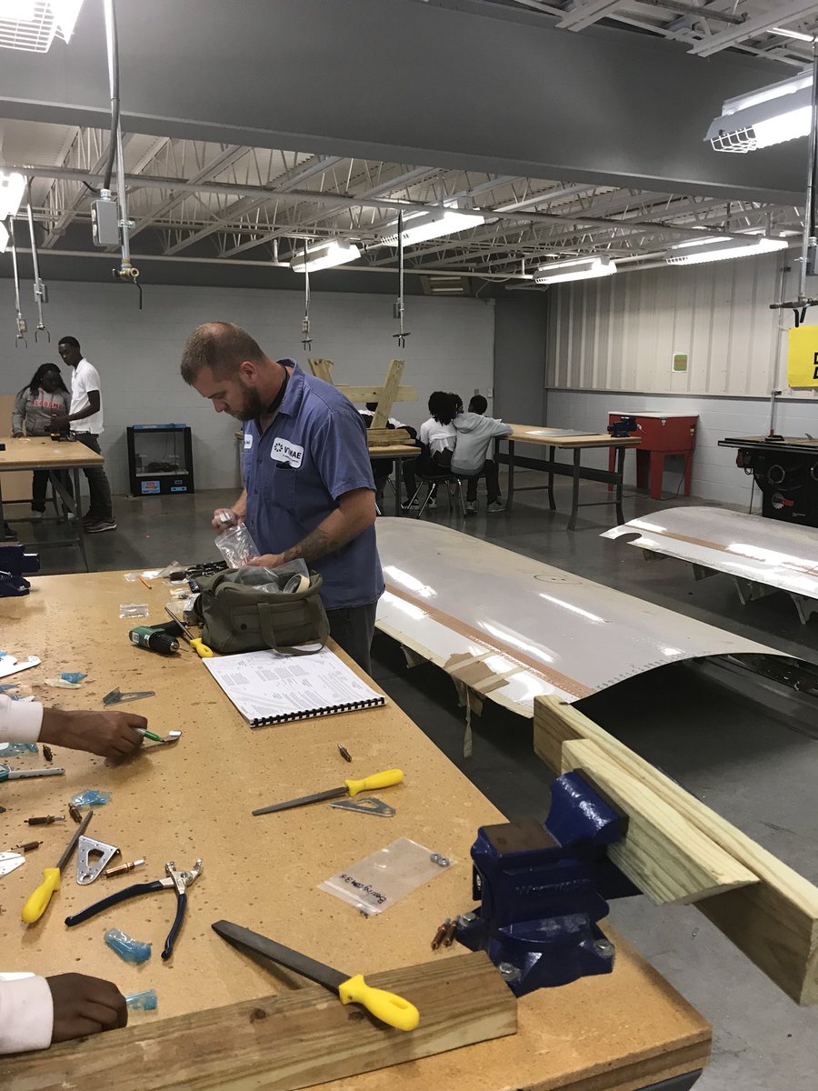 MobileAerospace's tweet photo. Our team has been helping at the local school Ben C. Rain with their airplane build. Here we have Gary showing them how to use certain tools. #teachthemearly #bencrain #tangoflight https://t.co/pqBtOIMju0