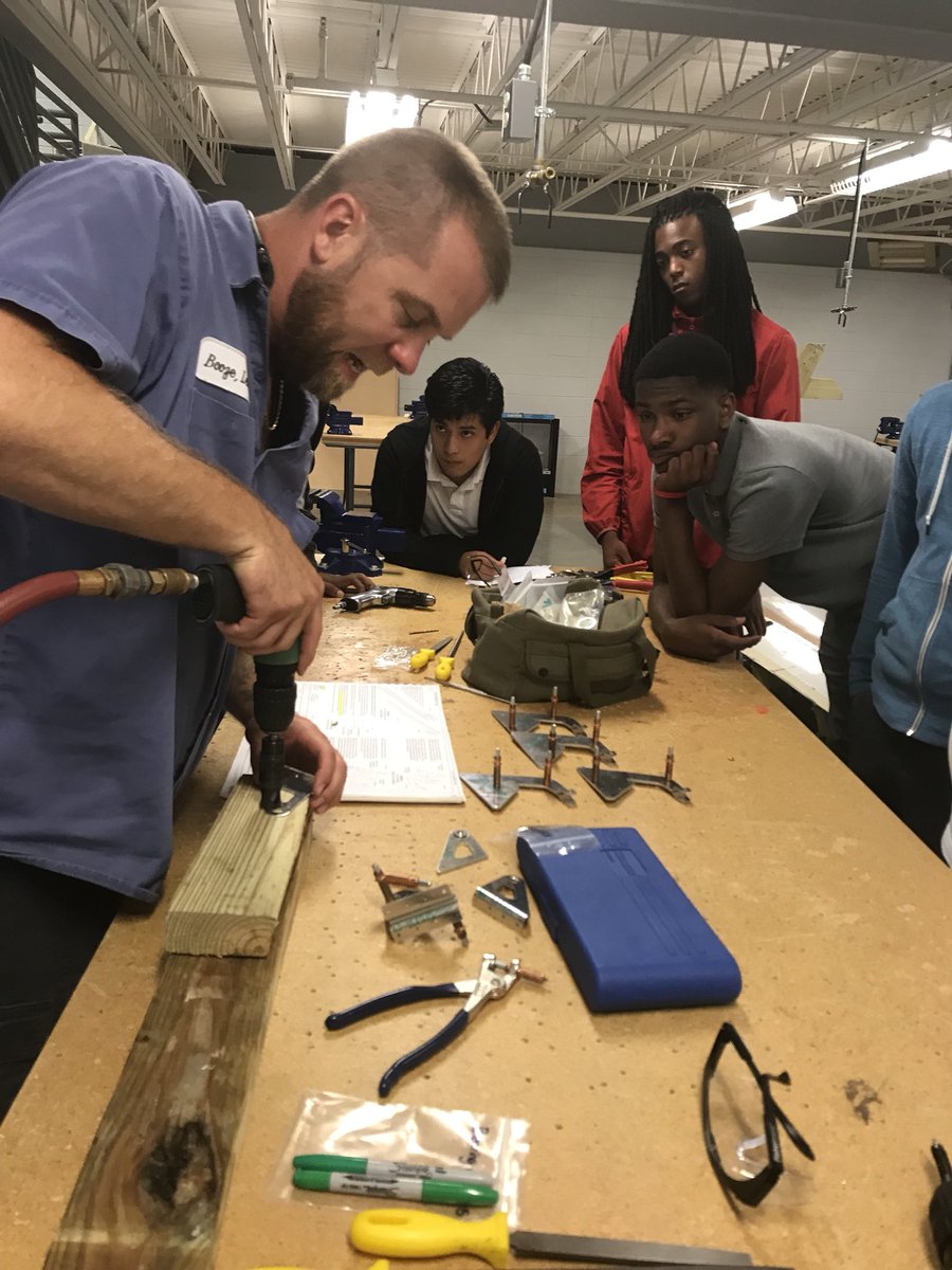 MobileAerospace's tweet photo. Our team has been helping at the local school Ben C. Rain with their airplane build. Here we have Gary showing them how to use certain tools. #teachthemearly #bencrain #tangoflight https://t.co/pqBtOIMju0