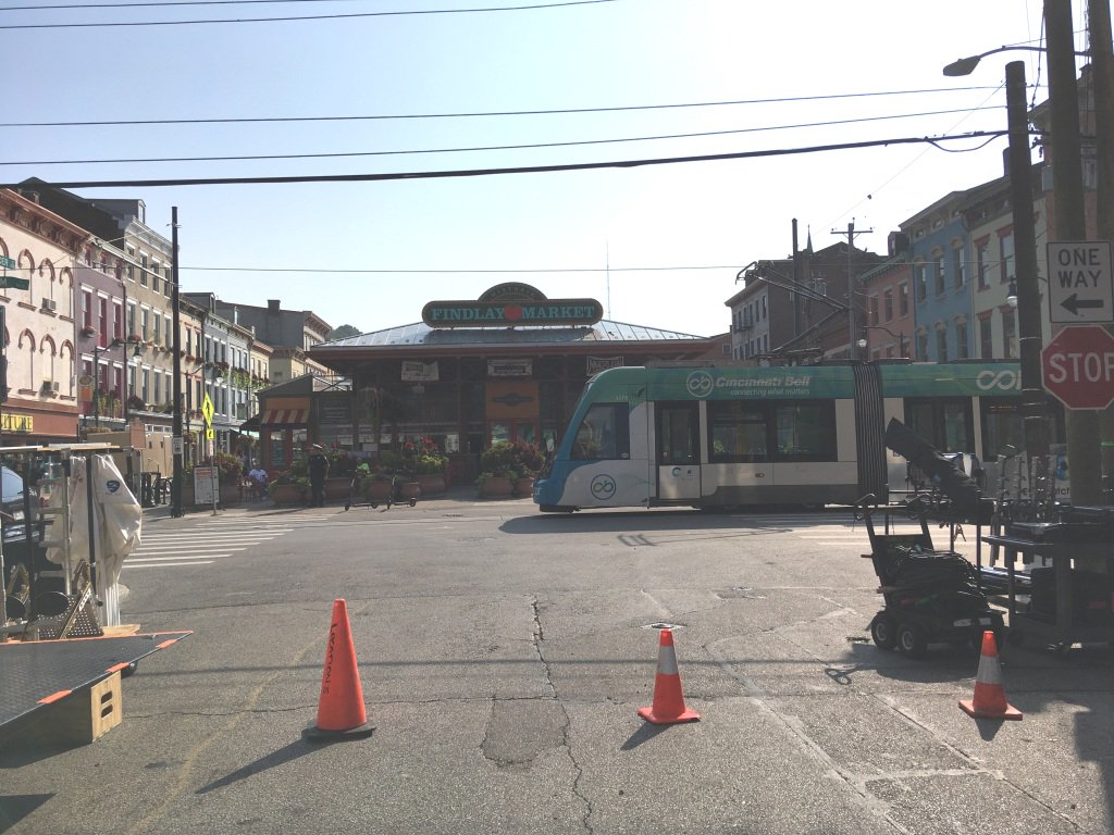 WeMoveCincy's tweet photo. Movie crews for 'Point Blank' continue filming today Aug. 28 by @FindlayMarket. Elm Street remains closed to thru passenger traffic at Liberty to Findlay streets 9 AM - 9 PM. Detour at Liberty to Central Pkwy. @CB_Connector &amp; @cincinnatimetro bus service continue uninterrupted. https://t.co/CpBUMPHskE