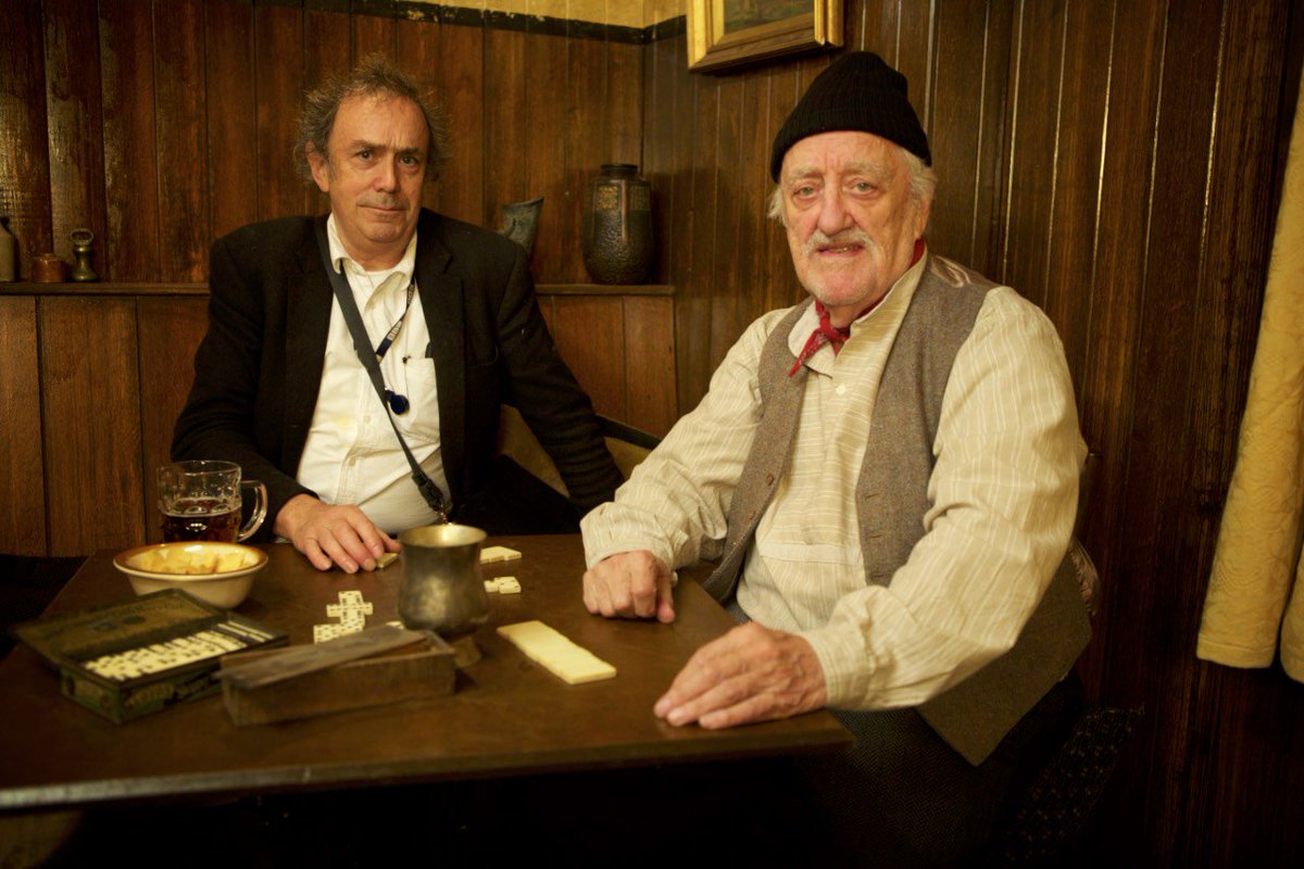 davidkerrtv's tweet photo. Very sorry to hear of the passing of #MichaelPickwoad. A gentle man of immense ingenuity, generosity and humility. Here he is with Bernard Cribbins in the bar he designed for A Midsummer Night's Dream. And on the bar blackboard, his priceless Shakespearean pun. https://t.co/1PK1Bqlsvu