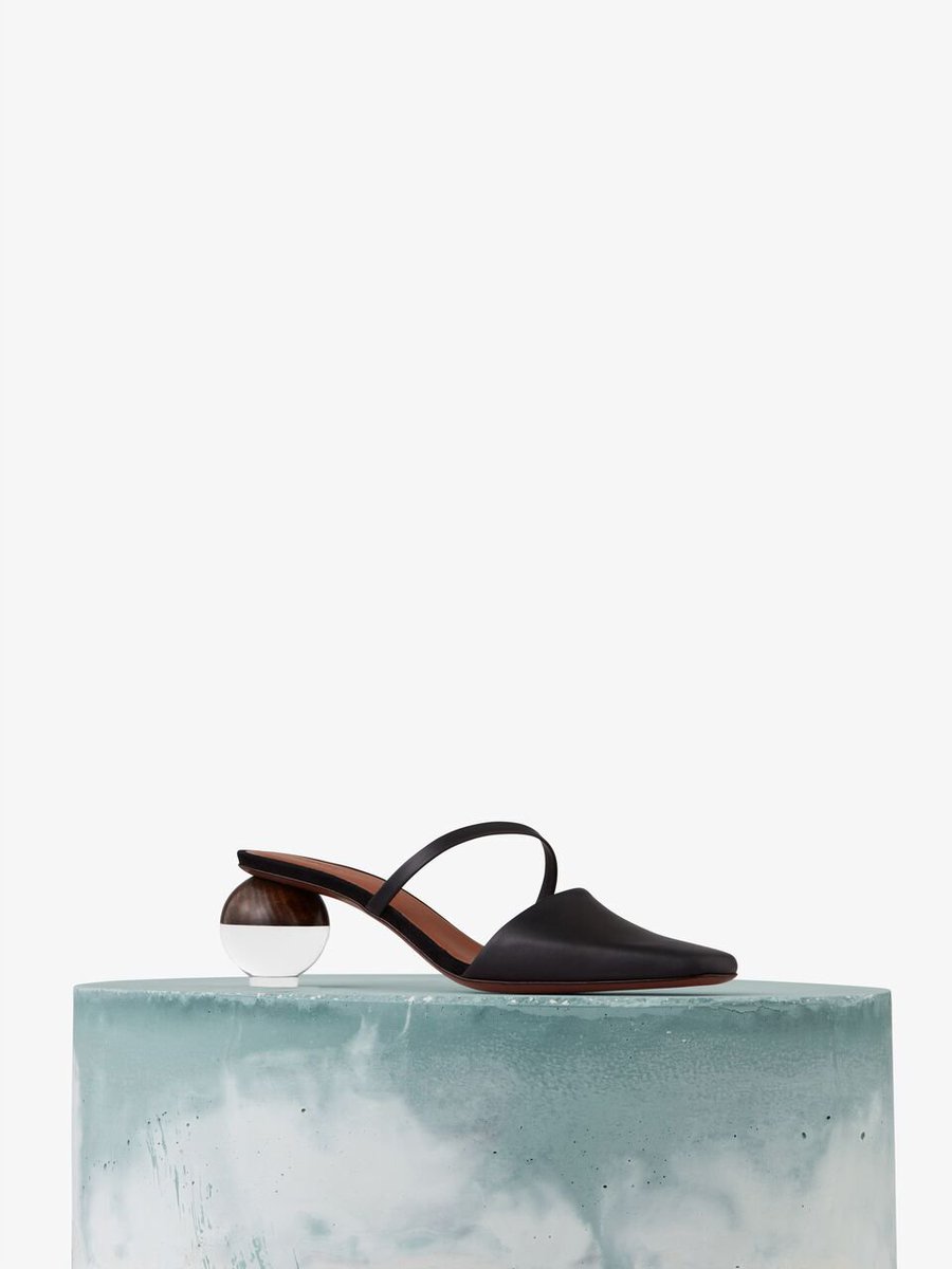 HarveyNichols's tweet photo. The new in #Neous Loda black leather mules, finished with hand-carved wood and perspex sphere heels, are the perfect paid of shoes to help you transition from Spring/Summer to Autumn/Winter. Shop now 👉 https://t.co/kDVG8PXYHp https://t.co/s1jSRnbTB5