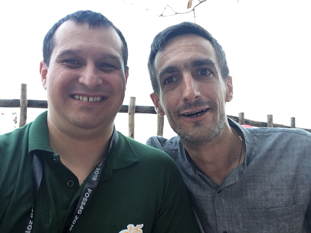 vcraciunescu's tweet photo. Hey @jachymc! Greetings from Coco Beach in Dar! @fenoy and me with #foss4ge #pywps tshirt https://t.co/MgfhgRsWit